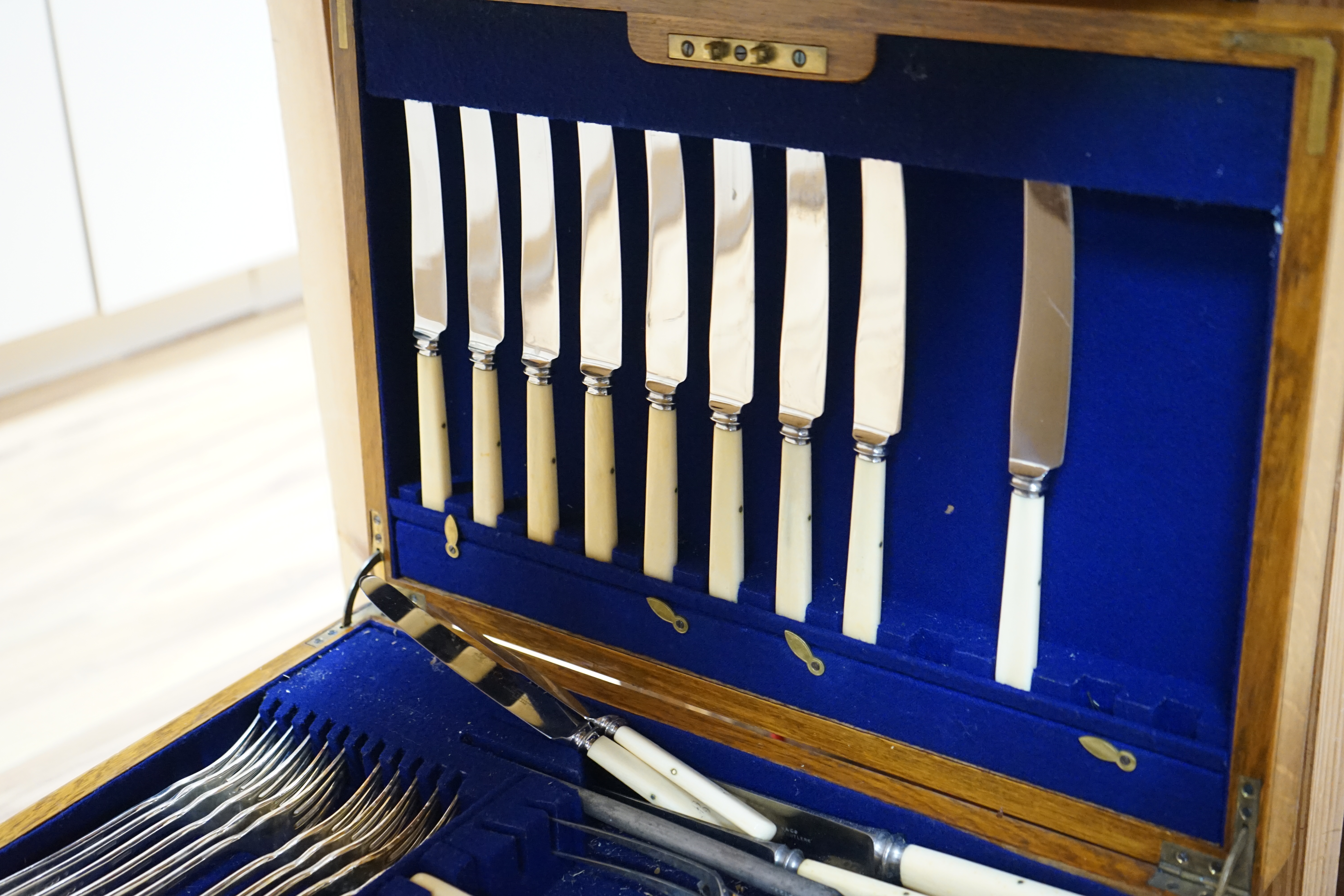 A large three layer oak canteen of plated Elkington and Co cutlery, Condition - good